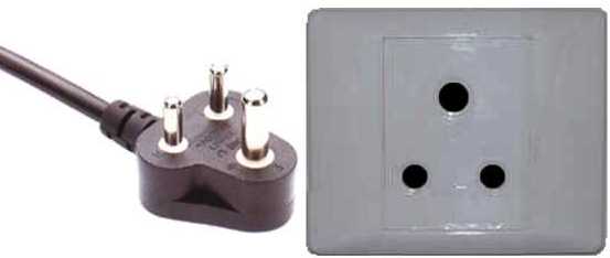 A South African Type M plug beside a matching wall socket